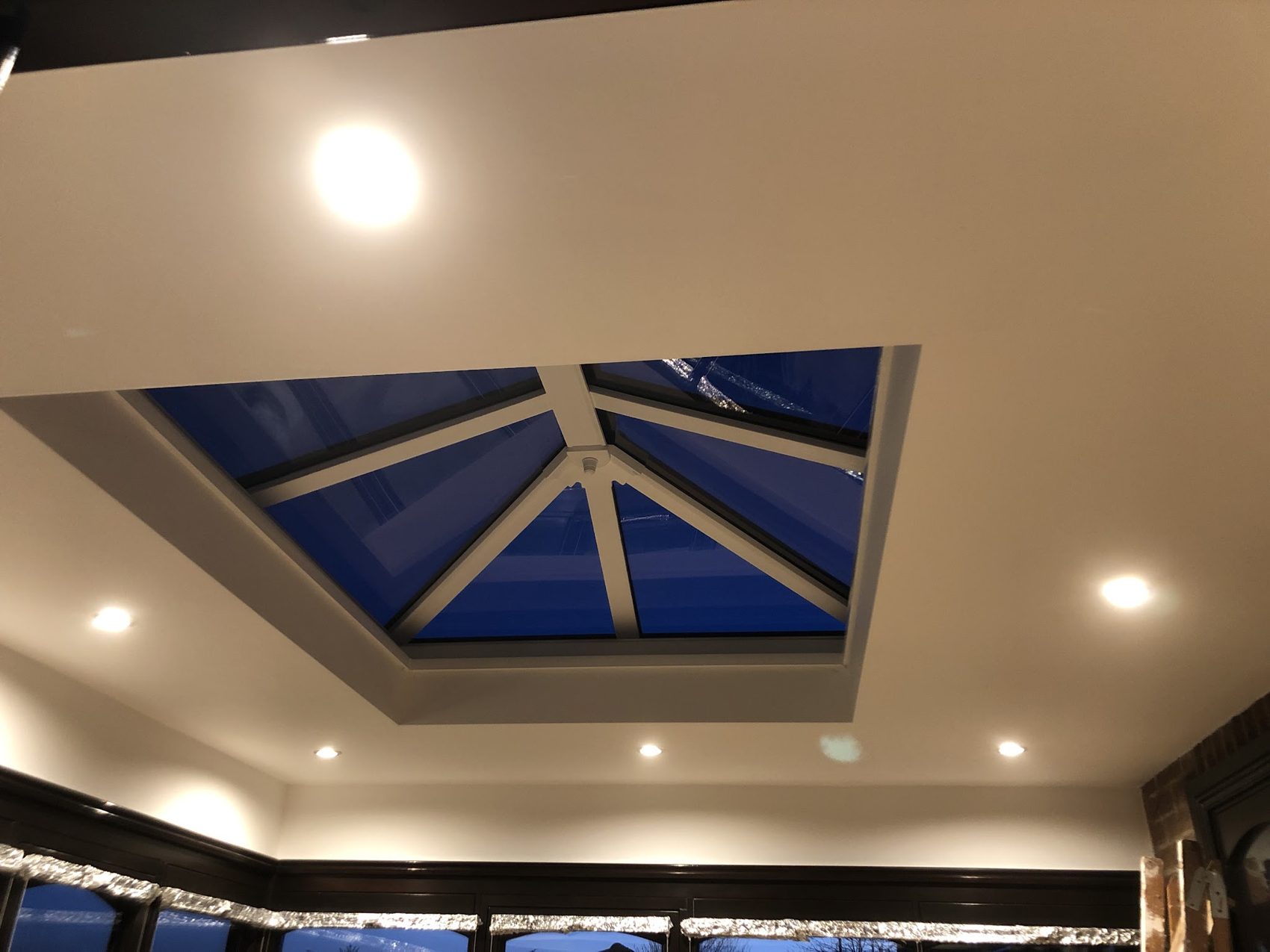 A lantern rooflight set into a ceiling with downlights